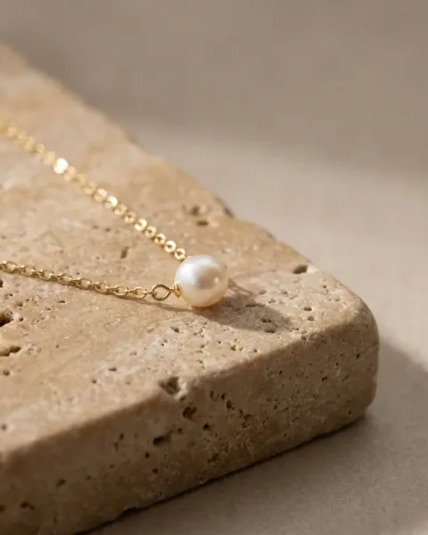The same necklace on a stone block, made with DesignerBox