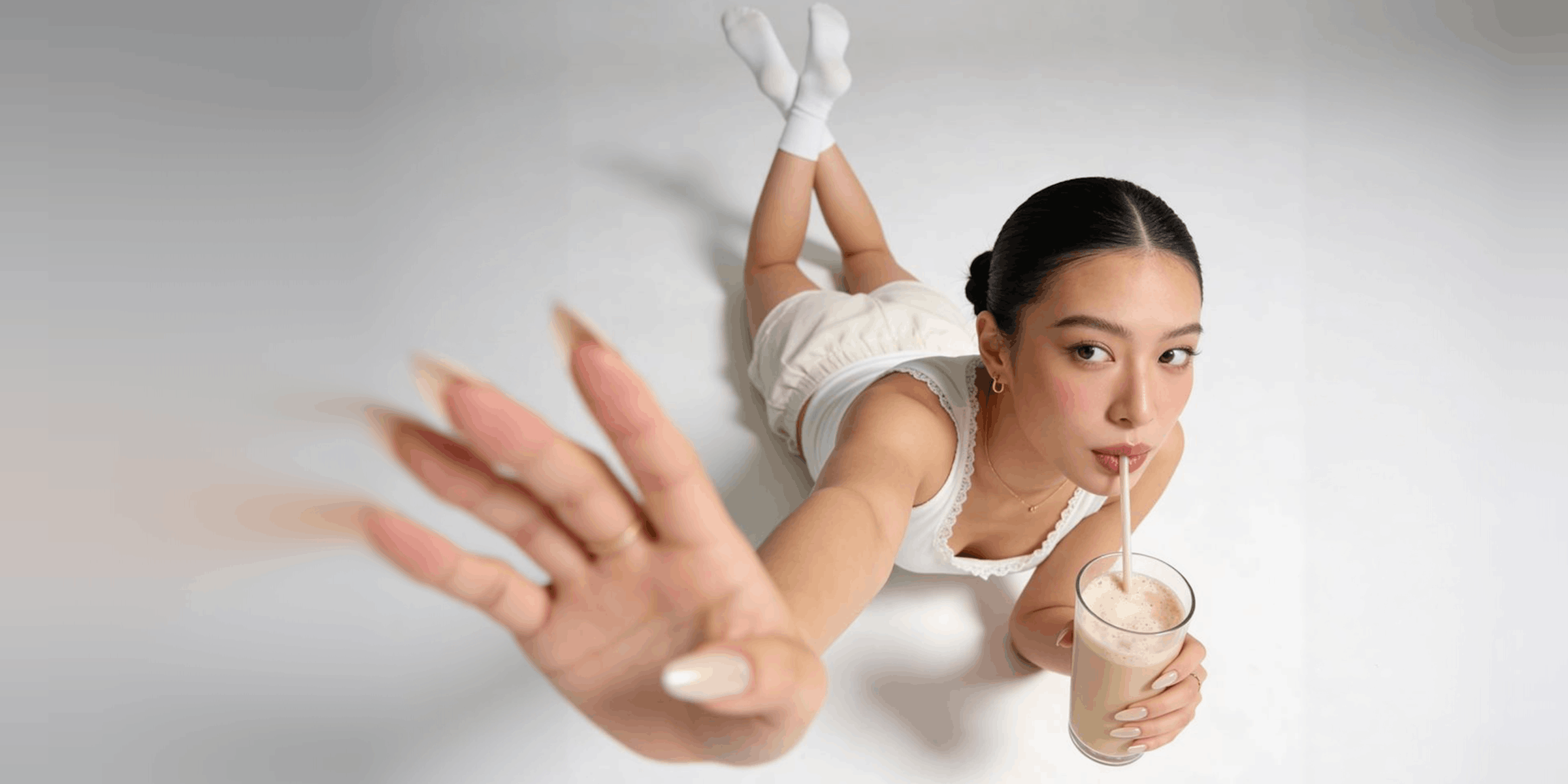A hand reaching for a drink mid-use, the kind of first frame a TikTok demo open starts on with the product already in motion