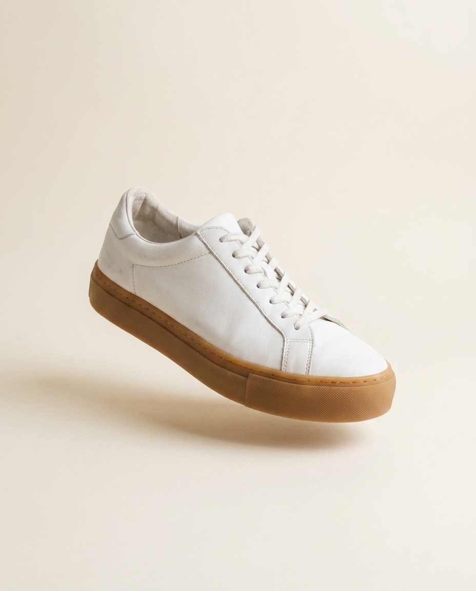 The same sneaker as a clean listing shot on warm off-white