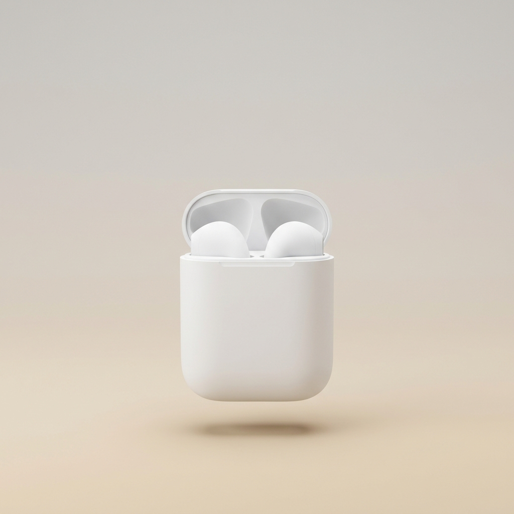 Matte white wireless earbuds in a charging case on a backdrop shading from pale warm grey down to soft sand.